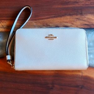 Coach wristlet, cream with gold accents
